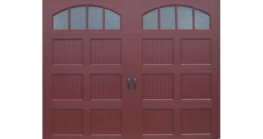 Picture of a red garage door with two windows at the top.