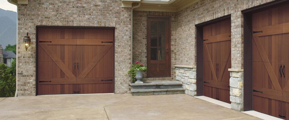 Picture of three wooden garage doors.
