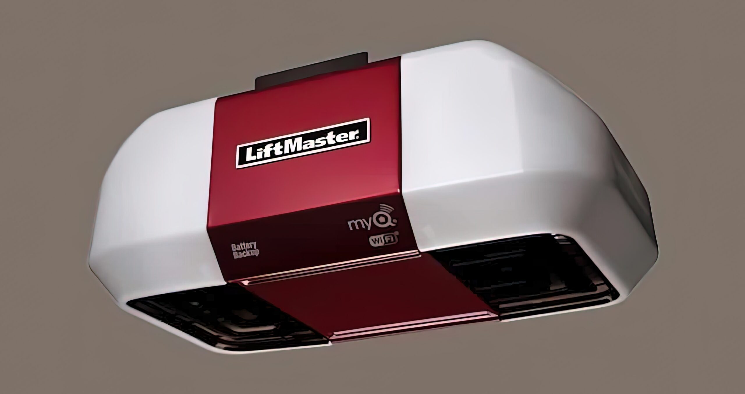 Red Liftmaster garage door opener with white light covers.